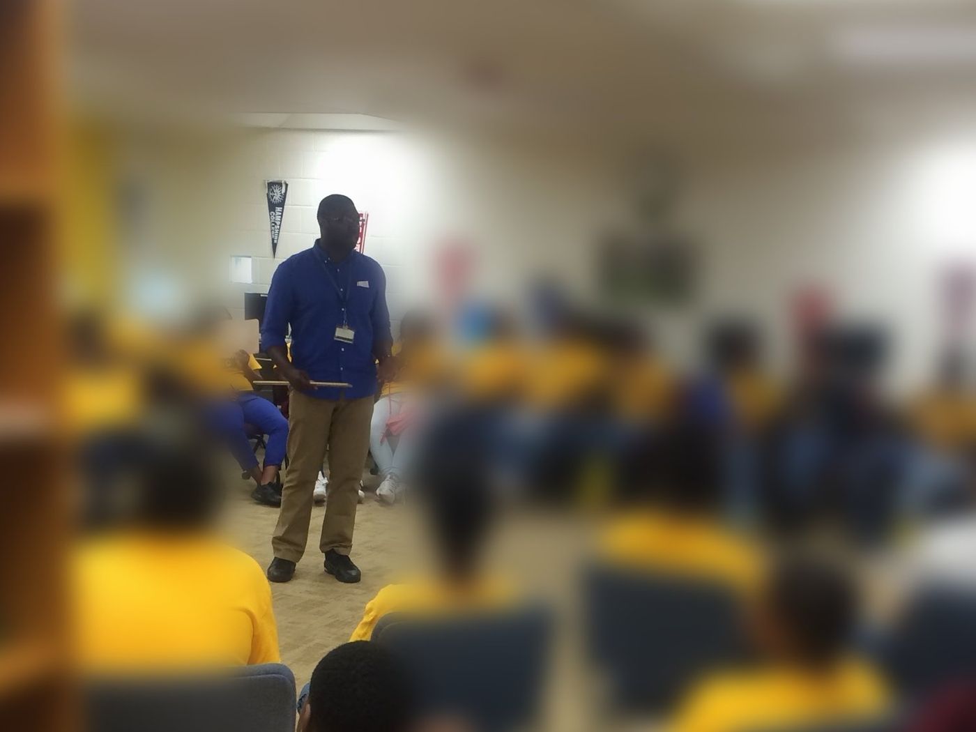 Lawrence teaching a room full of students