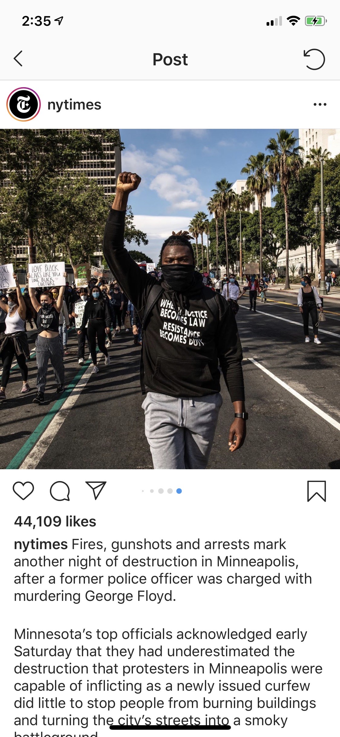 Lawrence marching with a raised fist, as posted by The New York Times