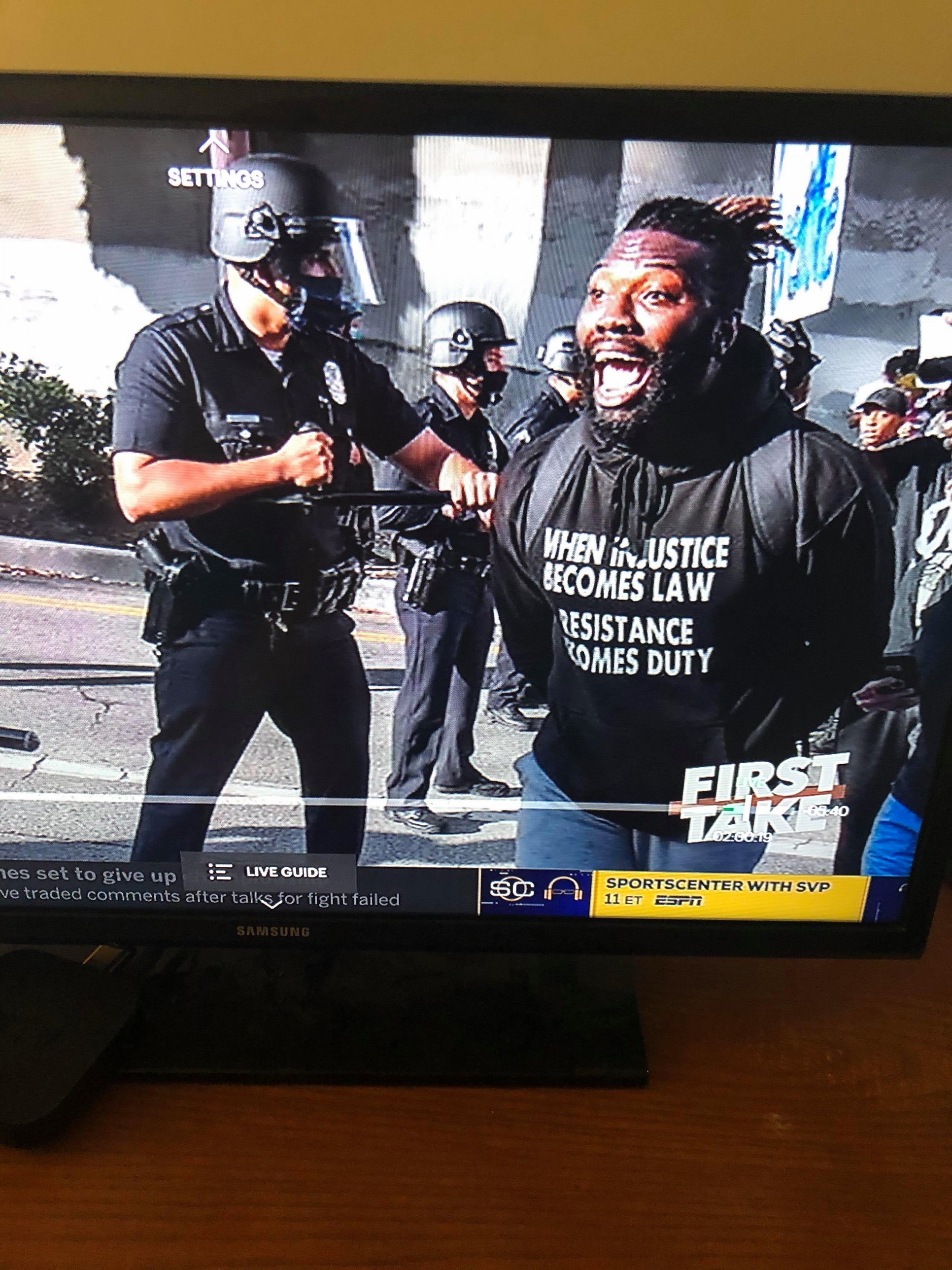 Lawrence at a police line, as aired on ESPN's First Take