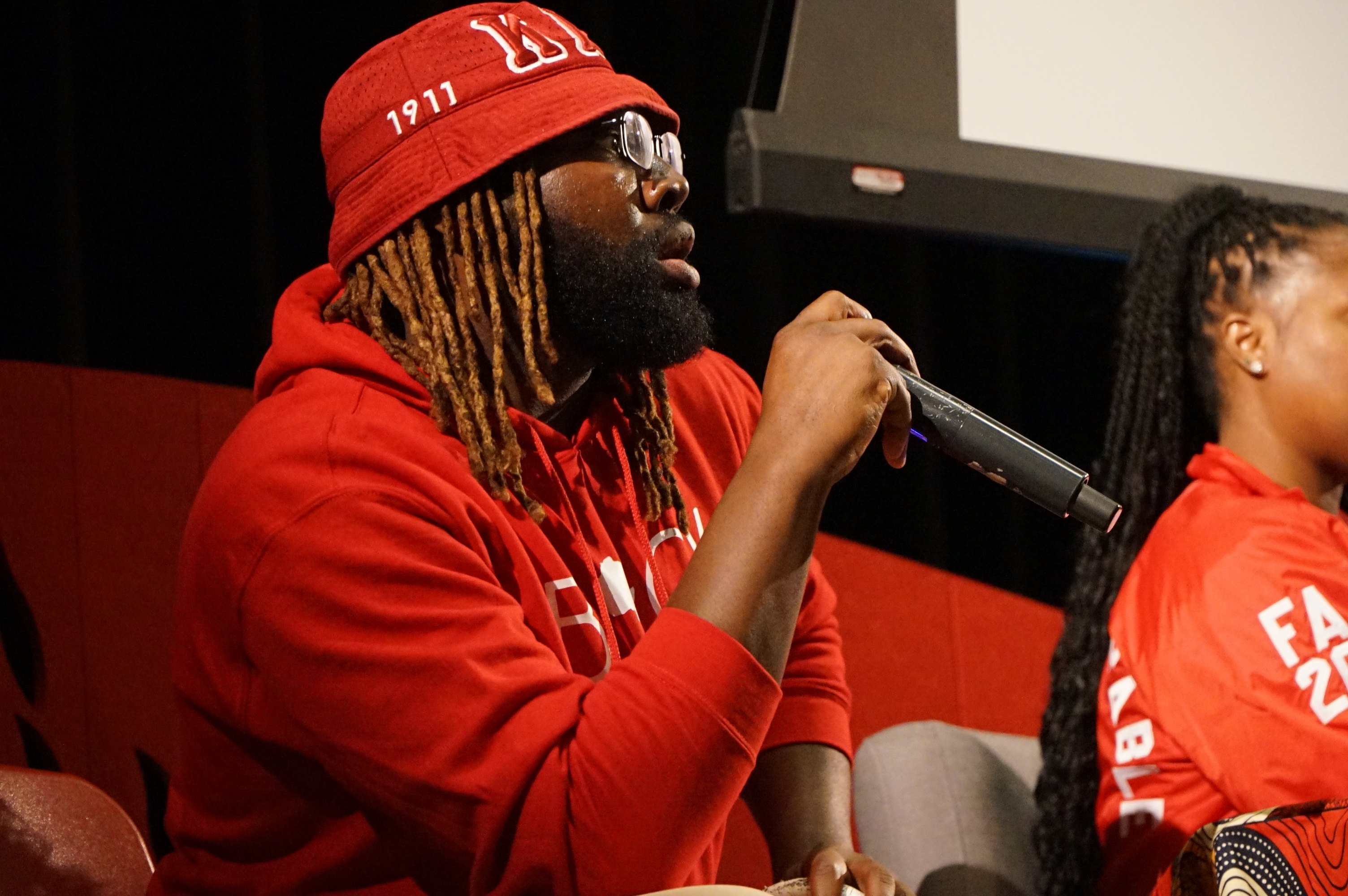 Lawrence speaking on a panel