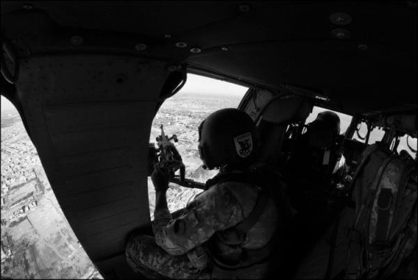 Door gunner position over Baghdad, in black and white